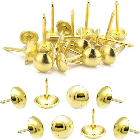 Tough As Nails Gold Metal Upholstery Tacks For Furniture Fixes And Slick Diy Upgrades 500 Pack Heavy Duty Brass Thumb Nails With Rust Resistant Coating For Sofas Chairs, close-up of various gold upholstery tacks.