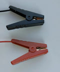 Close-up of red and black crocodile clips from 12 AWG Solar Panel Charging Cable Crocodile Clip To MC4 Connector 60cm Red For Power Station And Solar Panel Charger Lead Acid Battery Charging 12V 24V Easy Plug In Setup