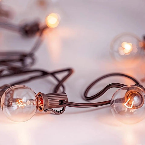 Close-up of G40 Replacement Bulbs 120V 5W Incandescent Globe Bulbs, 1.5 Inch Clear Globe, outdoor string lights glowing warmly