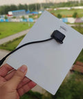 Ultra Thin Flexible CIGS Solar Panel Charger For Portable Power On The Go, Waterproof Photovoltaic Solar Cell held outdoors