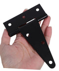 Heavy-duty extended T-hinge, black metal with mounting holes, front view, held in hand.