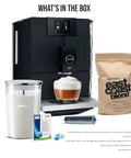 Straight Fire Automatic Espresso Coffee Maker Bundle With A Clean Matte Black Frame showing ENA 8 machine, glass milk container, coffee bag, and cleaning tablets.