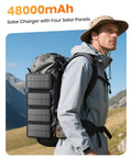 Man hiking with backpack holding On The Go 48000mAh Solar Charger Power Bank With Four Solar Panels Wireless Charging.