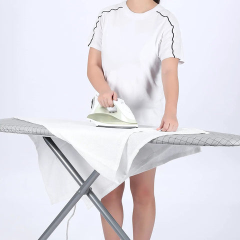 Person ironing on a board covered with Four Layer Thick Ironing Board Cover And Pad With Elastic 2 Inch Band Stain Resistant Durable
