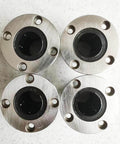 Top view of four Flanged Linear Bearing Bushing LMF25UU Chrome Steel SAE 52100 with Rubber Sealed Closure on a white surface.