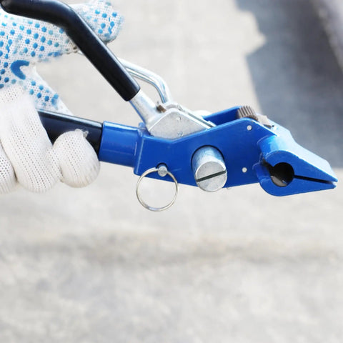 Kick Your Packaging Game Up With This Heavy Duty Steel Strapping Kit Featuring Smooth Ratchet Tensioner And Easy Cut Tool For Pallet Banding Plus Three Quarter Inch Coil And One Hundred Clips. Close-up of blue manual ratchet tool in use.