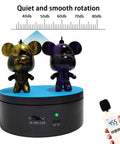 Black Motorized Rotating Display Stand, 360 Degree Automatic Silent Turntable For Epoxy Glitter Tumblers And Cups with two figures.