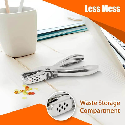 Six Pack Single Hole Puncher Set In Shiny Silver, showing waste storage compartment, on a desk with craft materials.