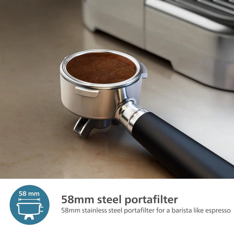 Semi Automatic Espresso Machine With Drip Free Barista Creations 58 Millimeter Portafilter showing 58mm steel portafilter with coffee grounds.