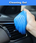 Blue cleaning gel being used on car air vent, a part of the All In One Pro Grade 15Pcs Car Interior Cleaning Kit With Windshield Cleaner Tool