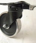 Heavy Duty 8 Inch Forged Steel Dual Wheel Caster Set With Kingpinless Swivel Directional Lock and Rigid Rollers, close-up view.