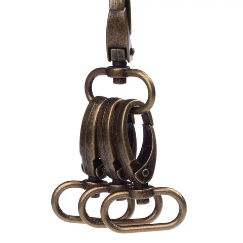 Dead Nuts Sturdy Curved Zinc Alloy Swivel Trigger Clasps For One Inch Webbing Bag Hardware Pack Of Twenty Featuring A Smooth Antique Brass Finish And No Sweat Snap Closure For Daily Gear, close-up view of swivel clasps.