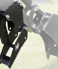 Universal Backhoe Thumb Attachment For Three And A Quarter Inch Boom Width With Heavy Duty Black Powder Coated Steel And Easy Bolt On Installation Compatible With Kubota Woods Mahindra Deere JD Tractors And More shown installed on a backhoe