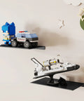 Slick 8 Inch Small Floating Wall Shelves displaying LEGO toys, matte black, heavy-duty metal storage for playful room decor.