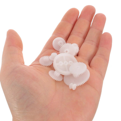 Top-Shelf Mini Plastic Gear Kit With Mechanical Project Parts Small Motor Components And DIY Hobby Accessories For School Engineering Models, shown in hand.