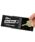 Extra Large Magnetic Key Hider Case For Big Keys Heavy Duty Key Holder with a hand placing a key inside black plastic box