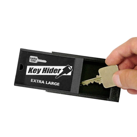 Extra Large Magnetic Key Hider Case For Big Keys Heavy Duty Key Holder with a hand placing a key inside black plastic box