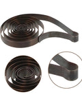 Close-up of a main spring from 4 Piece Mechanical Clock Main Spring Replacement Kit For Vintage Alarm Clocks DIY Restoration Low Maintenance Clock Parts Set For Home Office Or Collection Keeps Time Like A Pro.