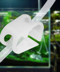Close-up of Five Pack Plastic Tubing Clamps For One Quarter To One Half Inch Tube OD Adjustable Hose Shut Off Clamps in lab setting.