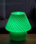 Swirl Mushroom Lamp With Vintage Striped Murano Glass glowing green, soft warm white LED, on desk