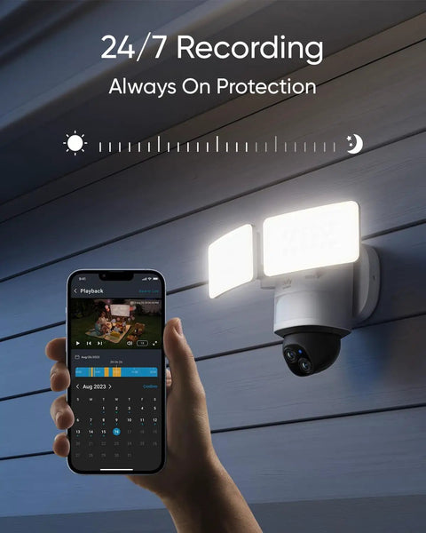 Dual-Lens 360 Coverage Outdoor Floodlight Security Cam With Pan And Tilt AI Detection And Tracking 8x Hybrid Zoom 2K And 3K Resolution 24 Seven Recording No Monthly Fee Wired Dual-Band WiFi 6 2000 Lumen installed on a wall with smartphone interface.
