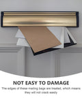 Beige Kraft Bubble Mailers With Self Seal Closure protruding through a gold mail slot, showcasing durable design for safe shipping.