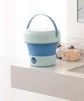 Foldable Mini Washing Machine 4.8 Liter Portable Compact Laundry Soaker for quick rinse on countertop with timer display.