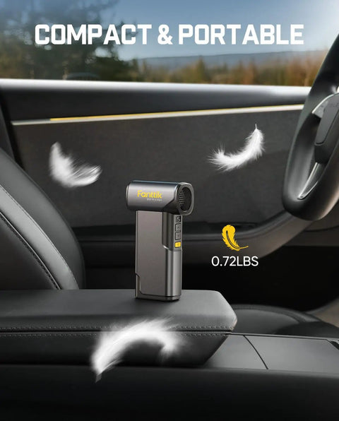 Compact grey B10 Pro Max Cordless Electric Air Duster with 130000 RPM Brushless Motor, shown on car seat armrest.
