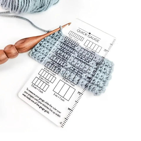Super Crisp Acrylic Gauge Ruler For Knitting And Crochet No Sweat Stitch Measurement Guide With Transparent Grid over fabric swatches.