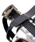 Close-up of adjustable webbing strap on bike pedals with toe clips and straps for indoor cycling, non-slip surface, 14mm axle, 9/16 thread.