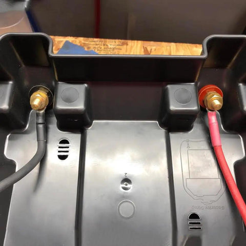 No Sweat M10 Remote Battery Terminals And 250 Amp Jump Post for Quick Terminal Relocation installed in a black battery box.