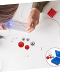 Student assembling 5-Piece Pendulum Ball Assembly Kit For Physics Education And Mechanics Learning with steel, plastic balls