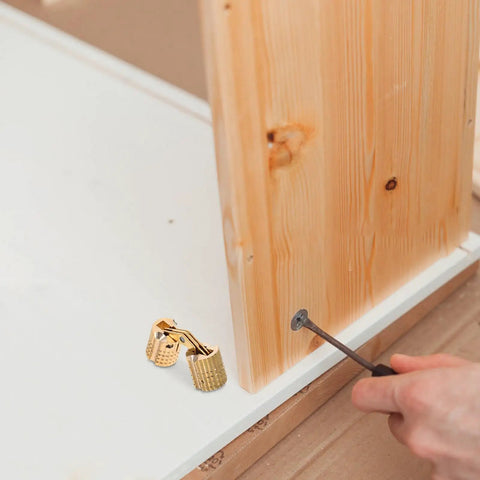 Smooth Operator Brass Concealed Barrel Hinges Six Piece Kit with screwdriver and wood for DIY projects.