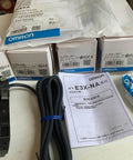 PNP Optical Fiber Amplifier Sensor E3X NA41 Photoelectric Sensor with packaging and manuals, ideal for automation lines