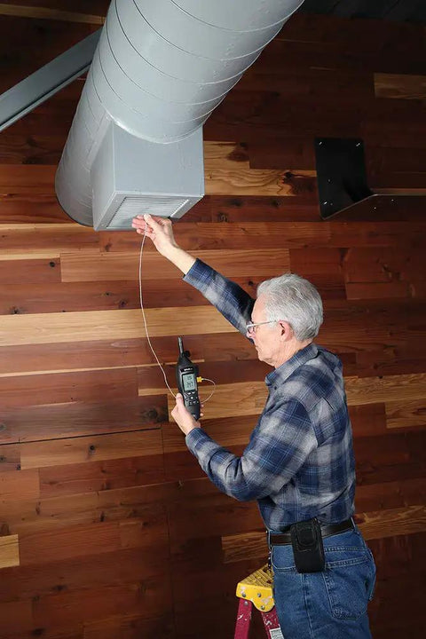 Person using EM54 HVAC and Refrigeration Environmental Meter for Pros Continuity Testing of Nonenergized Components on duct