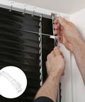 Person installing Thirty Piece Set Of Transparent Valance Clips For Window Blinds 2.5 Inch Hidden Track Holders on blinds.