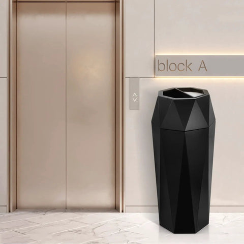 Top Shelf Commercial Trash Can And Outdoor Garbage Bin With Snug Lid Super Tough Stainless Steel Waste Container Made To Take A Beating For High Traffic Shops Or Offices Matte Black Trim near elevator.