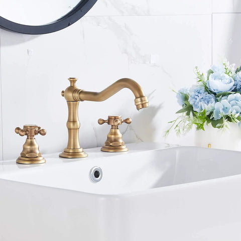 8 Inch Widespread Bathroom Sink Faucet with Two Handles and Three Holes Antique Brass Basin Mixer Tap installed on white sink