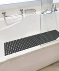 No Sweat Non Slip Shower Mat For Tub, Heavy Duty Premium TPE Bathtub Rug, 27.5 x 15.7 inches, black non-slip surface in bathtub.