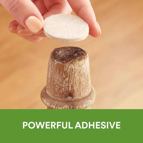 Top Shelf Felt Furniture Protectors For Hardwood Floors Beige Self Stick Pads being applied to a wooden chair leg.