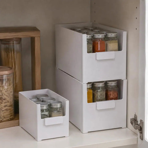 Versatile Big Capacity Heavy Duty Stackable Storage Bins Open Top Space Saving Closet Organizer With Slick Zero Hassle Design For Bedroom Bathroom And Kitchen Game Changer holding spice jars in a kitchen cabinet.