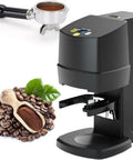 Automatic Espresso Tamper 58mm Electric Coffee Press With Adjustable 22 To 66 Lbs Pressure For A No Sweat Daily Grind And Smooth Operator Shot Consistency All Day Long Black next to coffee beans and scoop.