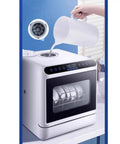 Slick Portable Countertop Dishwasher Fully Automatic Mini Appliance pouring water, showing touch interface and dishes inside.