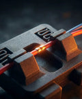 Close-up of 2 Pcs Hands Free Electric Wire Welding Fixture Portable Soldering Jig Tool with soldered wires for automotive use.