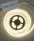 All Weather 100W 12V DC LED Driver Power Supply IP67 Waterproof Outdoor Transformer next to illuminated LED strip