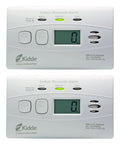 Two Carbon Monoxide Detector With Ten Year Battery Digital Display Three LEDs Replacement Indicator Peak Level Memory Two Pack For Easy Home Safety No Wiring Needed And It Alerts On Power Outage With An 85 Decibel Alarm devices with digital screens and buttons on a white background.