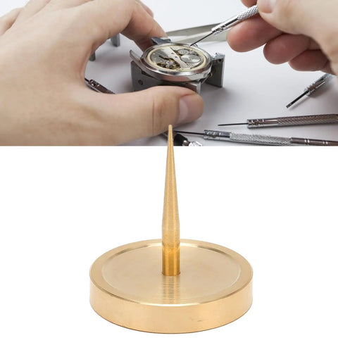 Watch Balance Wheel Bracket Copper Holder For Repairs, tool on workbench with hands and watch components, close-up view