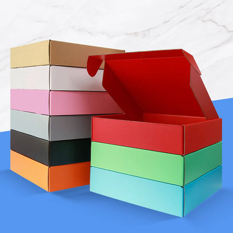 Stack of colorful cardboard boxes with one red box open, showing various colors for Grey Cardboard Shipping Boxes Pack Of 20 Lightweight Corrugated Mailer Boxes For Ecommerce Packaging L8xW5.5xH1.5 Inches Durable Fulfillment Boxes Ideal For Small Biz.