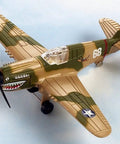 Die-cast P-40 War Hawk model airplane with detailed camouflage and shark teeth design, part of connectible runway system.