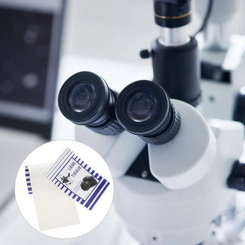 Lens cleaning paper sheets (100 pcs) for optics; inset shows white sheets and blue striped packaging.